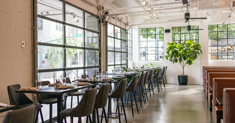 Interior, high seating chairs and tables by the windows