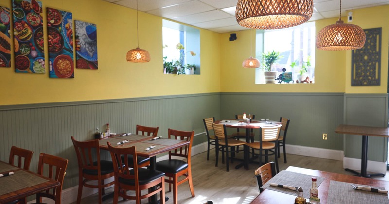 Interior seating area with wooden chairs and tables