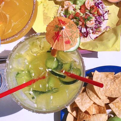 A glass of cocktail with decoration, top view