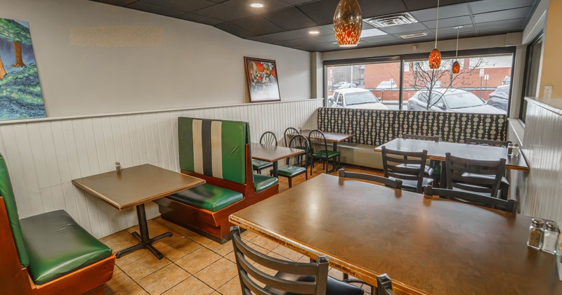 Restaurant interior with booths, tables, and chairs