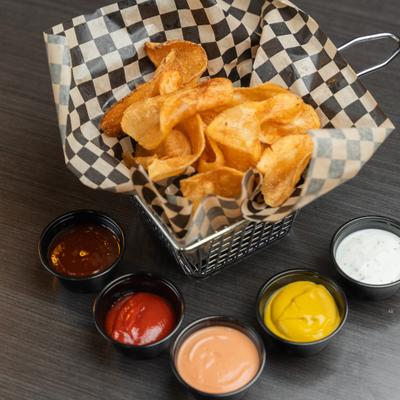 Potato chips with dipping sauces.