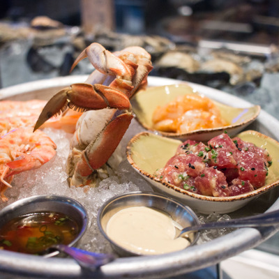 top of seafood tower displaying a variety of seafood offerings