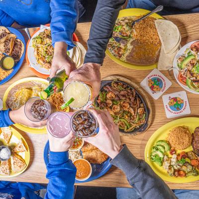 people cheers to Rancho dinner.