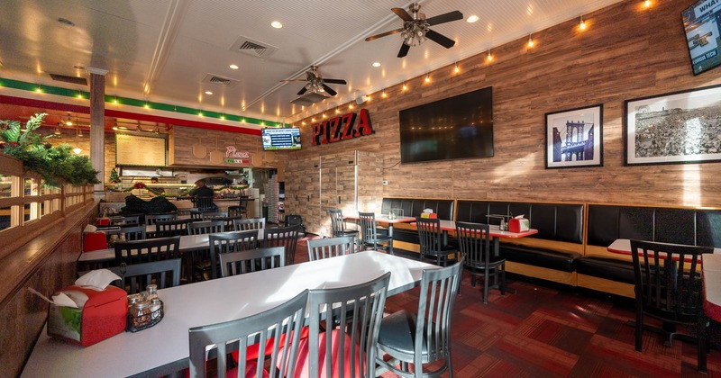 Interior, dining area, tables with chairs, banquette bench with chairs and tables