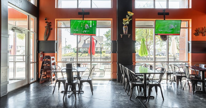 Interior, seating place with tv screens above windows