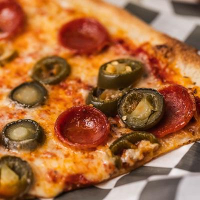 Pepperoni and jalapeno pizza, closeup.
