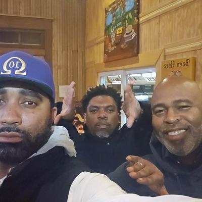 Three friends posing for a photo.