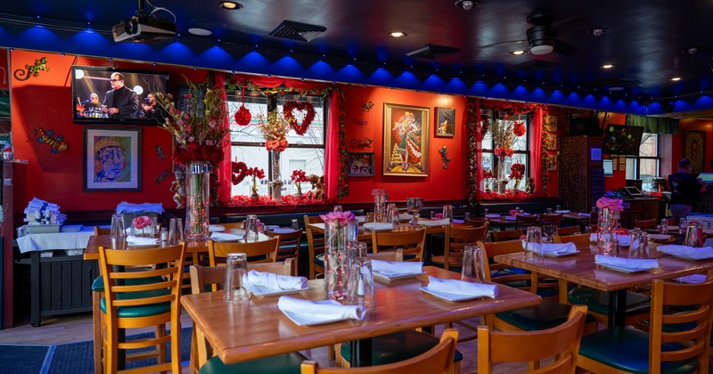 Romantic decorated restaurant interior with set dining tables