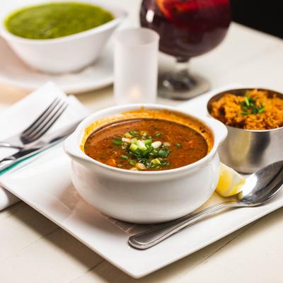 Gumbo, with oysters, crab, shrimp, andouille sausage, tomato, and Cajun rice.