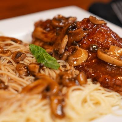 Chicken Marsala with mushrooms and fettuccine.