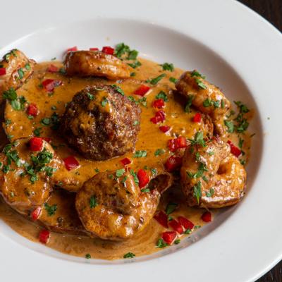 Shrimp, with black pepper cream sauce, and an arancini ball