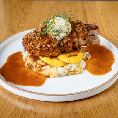 Bone in pork chop with summer squash adn herb mashed potatoes.