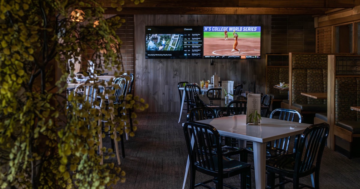 Seating area, TV showing baseball