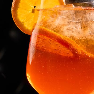 Glass with aperol spritz.