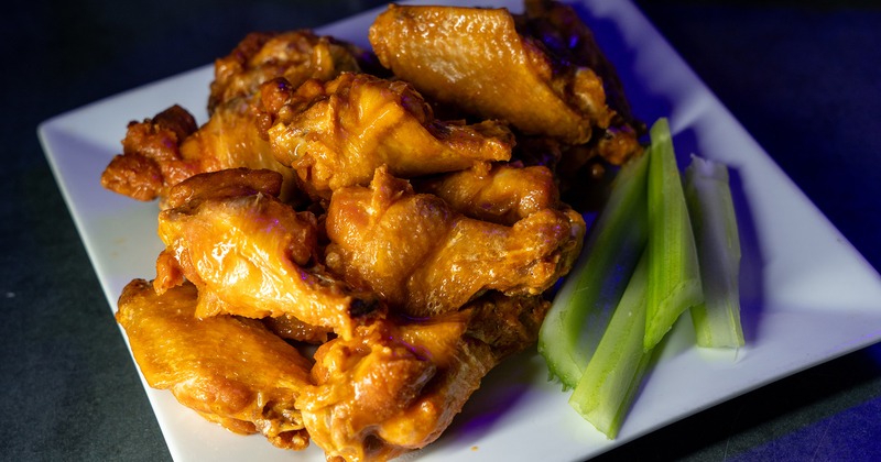 Chicken wings served with celery