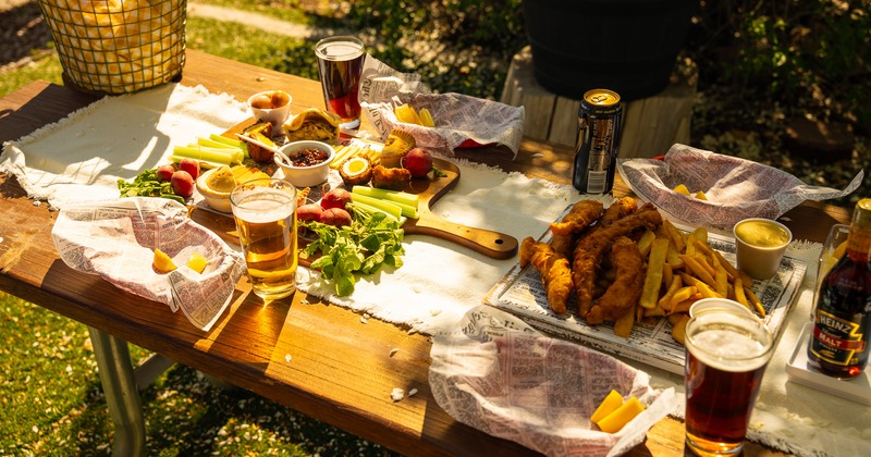 Interior, guests helping themselves to food from catering trays