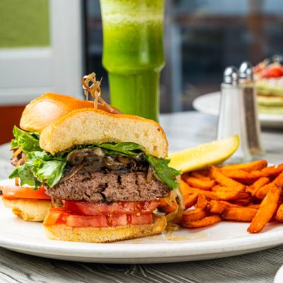 Mushroom Cheeseburger served with sweet potato fries.