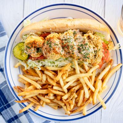 Shrimp and oyster Po' Boy and fries.