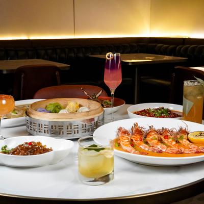 Assortment of dishes served on the table with cocktails.