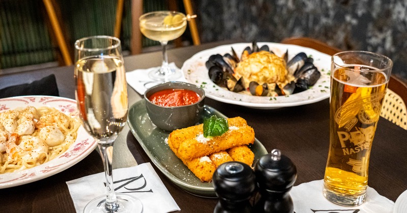 A table with various food dishes and drinks