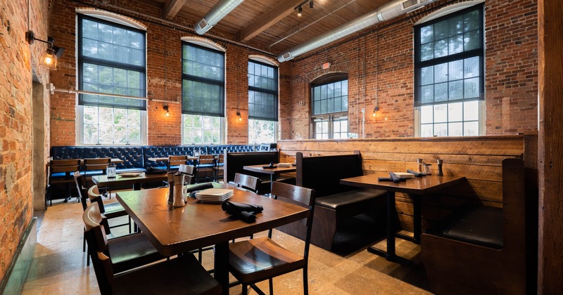 Bright interior, dining tables ready for guests