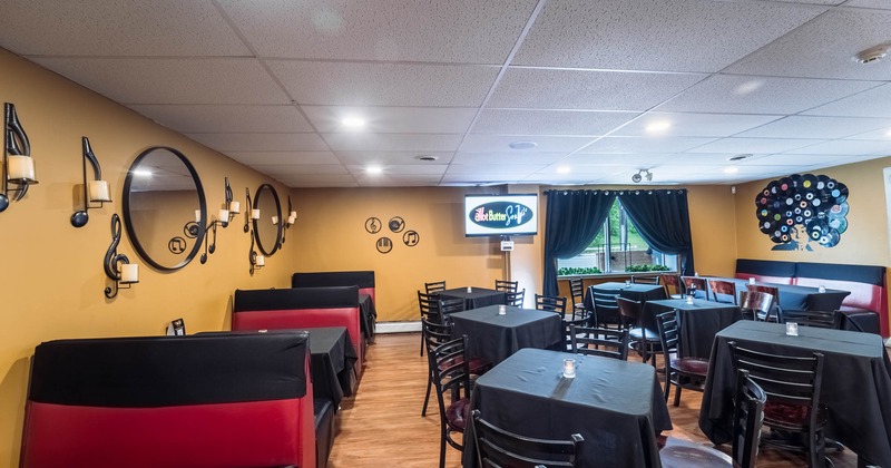 Inside, booth area on the left, tables and chairs