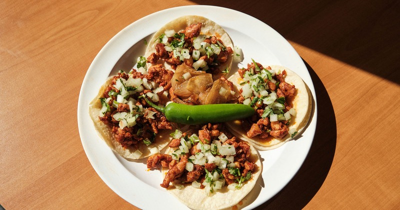 Pork tacos, with onions, and cilantro