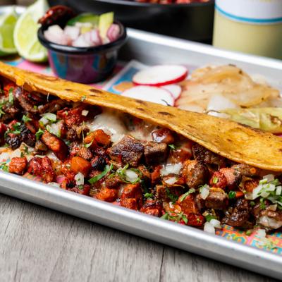 A quesadilla filled with diced, seasoned marinated pork and melted cheese.