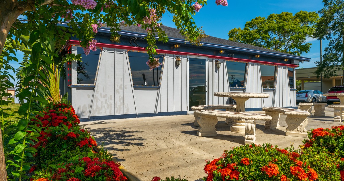 Exterior, front view, table, benches