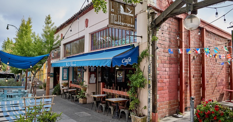 Outdoor seating area in front of the restaurant entrance