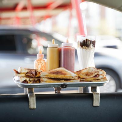 tray of food hanging on car window.