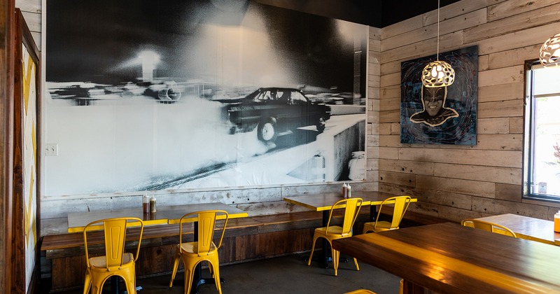 Interior space, dining area, tables and yellow chairs
