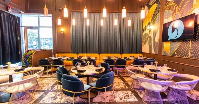 Interior, chairs, tables, curtains, wall decorations, lighting