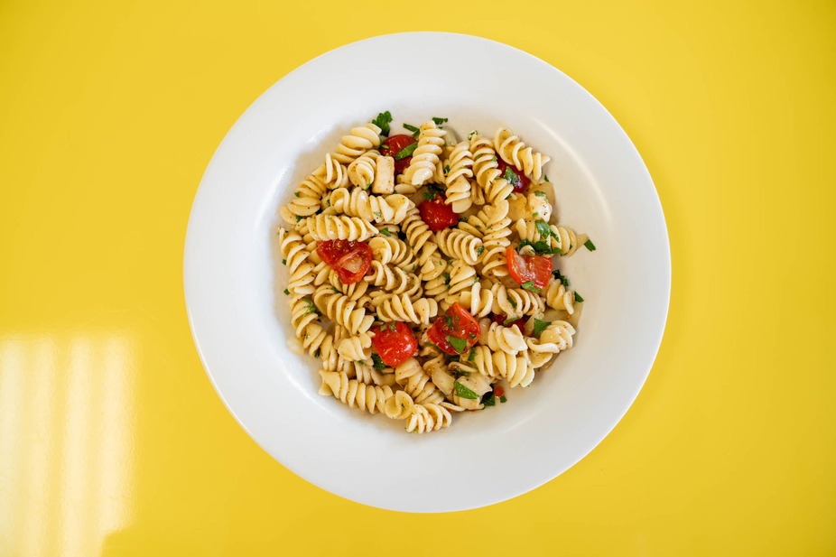 Home-made Pasta Salad with cherry tomatoes and herbs.