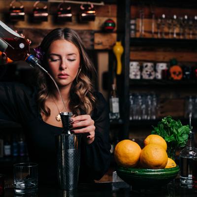 Bartender making a cocktail.