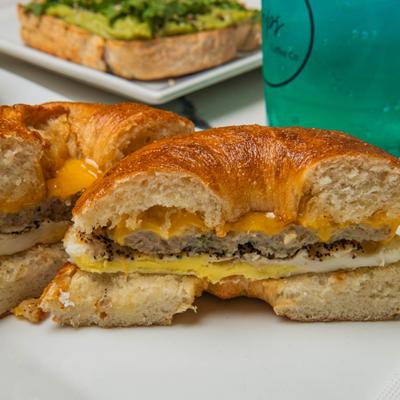 Bagel sandwich with egg, sausage patty, and cheese.