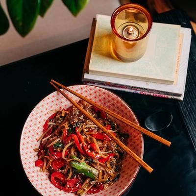 Drunken Noodles, with mixed vegetables, and sesame seeds.