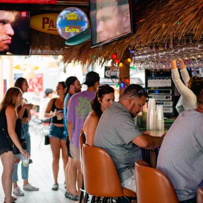 interior shot of 8 guests at the bar