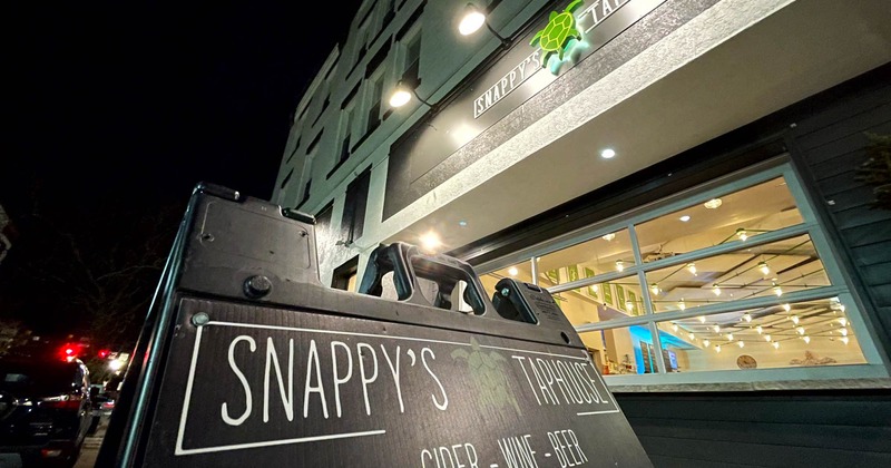 Exterior, a Snappy's Taphouse sign on the sidewalk in front