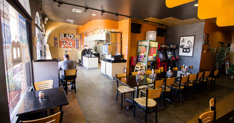 Dining area, counter, arcade machines