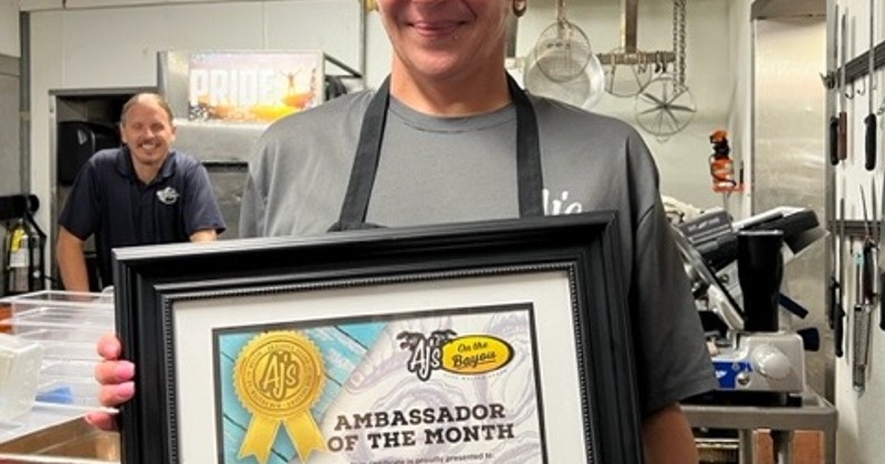 Employee in kitchen who received an award.
