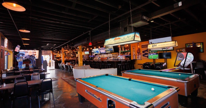 Interior, pool tables, arcade games behind