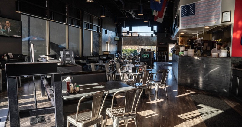 Interior, dining area, tables set for guests