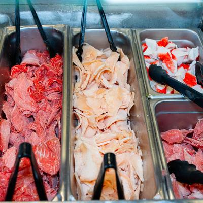 Food bar, a selection of protein options for a build-your-own stir-fry.