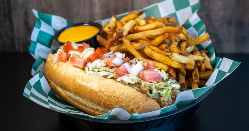 Cheesesteak Hoagie served with fries and a cheese dip