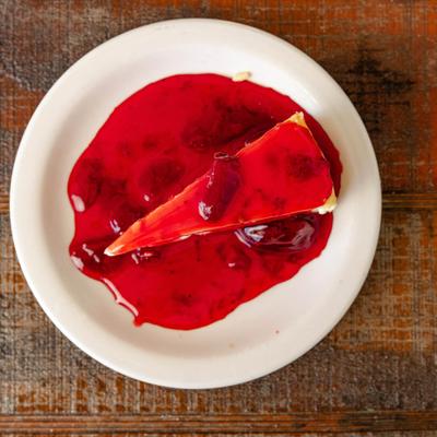 Slice of Strawberry Cheesecake, top view.