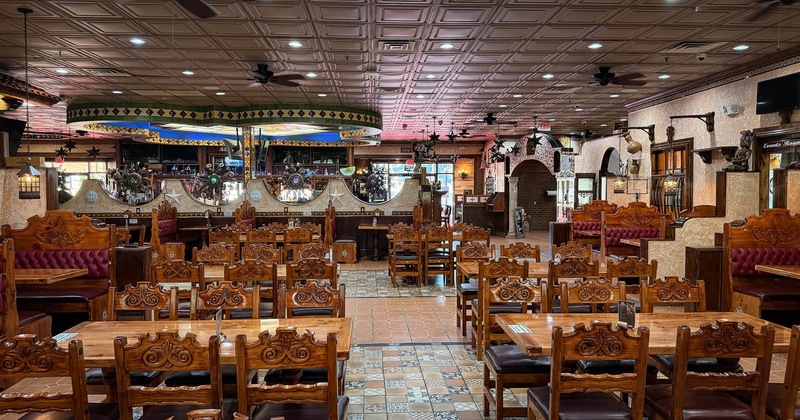 Interior, seating area with traditional wooden chairs