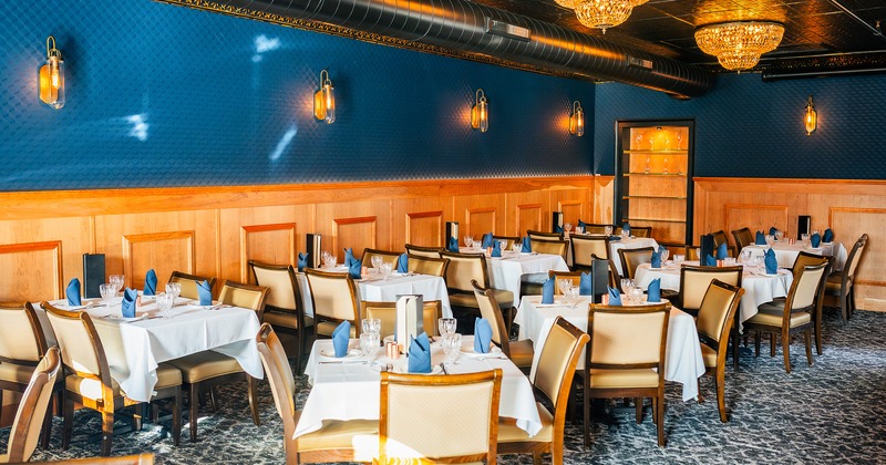 Restaurant interior, dining room with set tables