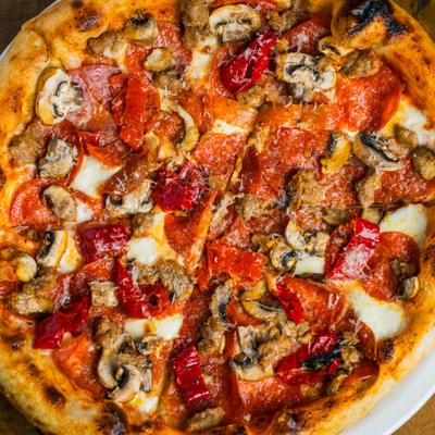 Handcrafted Italian pizza topped with Hungarian peppers, mushrooms, pepperoni and cheese.