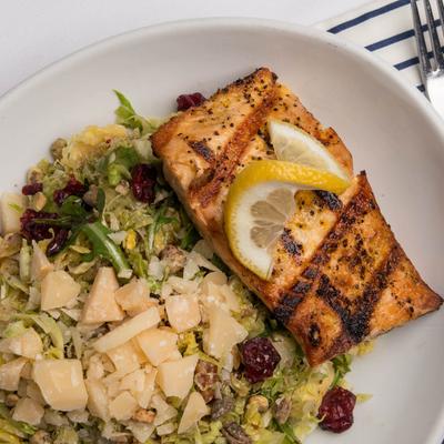 Brussels sprouts salad with grilled salmon filet